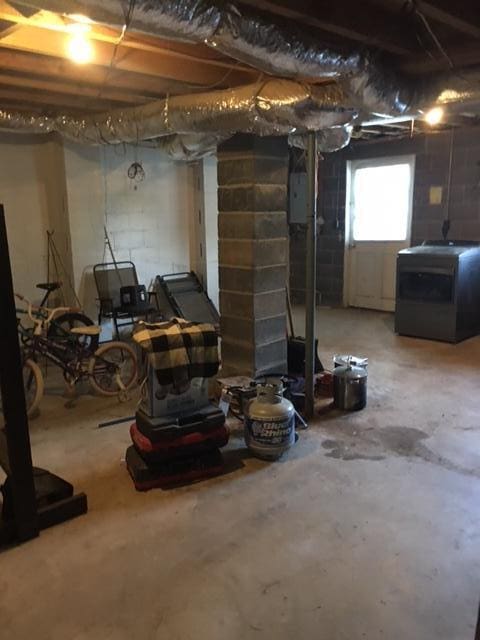 basement with electric panel and washer / clothes dryer