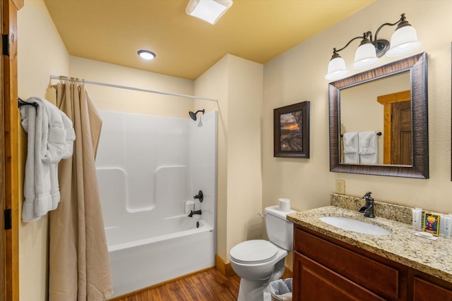 full bathroom featuring hardwood / wood-style flooring, vanity, toilet, and shower / bath combination with curtain