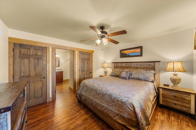 bedroom with dark wood-type flooring and ceiling fan