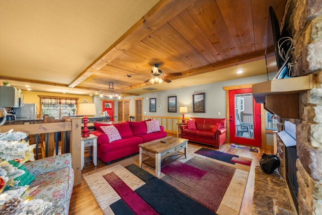 living room with ceiling fan, wood ceiling, light hardwood / wood-style floors, and beamed ceiling