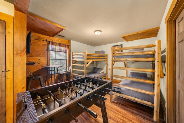 bedroom featuring wood-type flooring and a textured ceiling