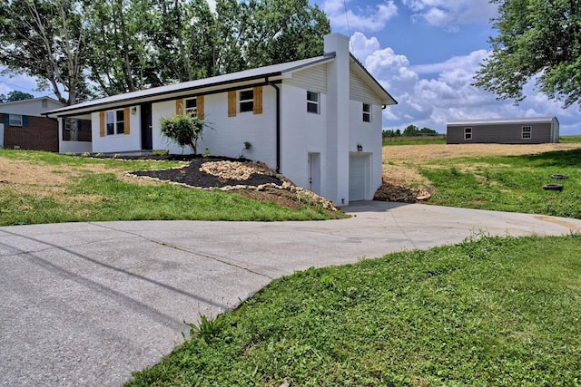 3646 Falcon Rd, Morristown, TN 37814 - ranch-style home featuring concrete driveway, an attached garage, a chimney, a front yard, and brick siding