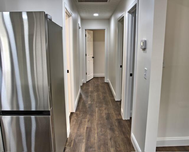 3646 Falcon Rd, Morristown, TN 37814 - corridor featuring baseboards and dark wood finished floors