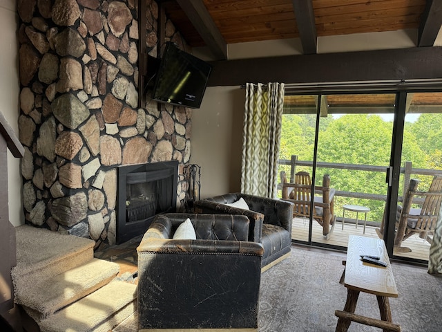 1081 Cove Rd Unit 734, Sevierville, TN 37876 - living room with a stone fireplace and wooden ceiling with exposed beams