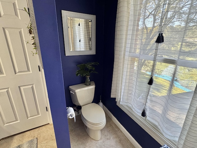 bathroom with tile patterned floors and toilet