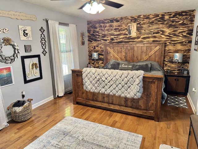 bedroom featuring ceiling fan and wood-type flooring