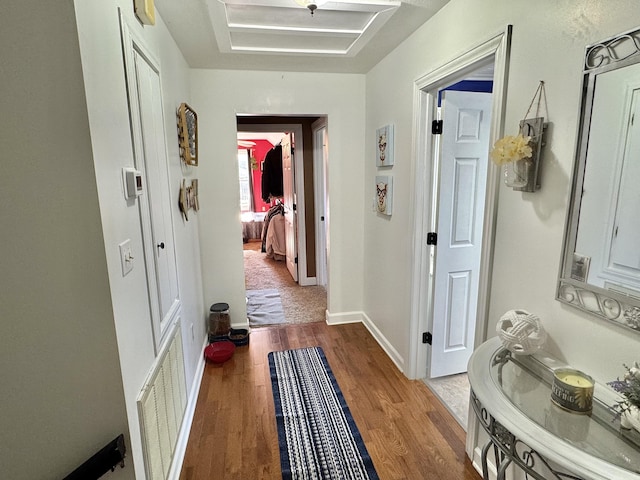 hall featuring wood-type flooring