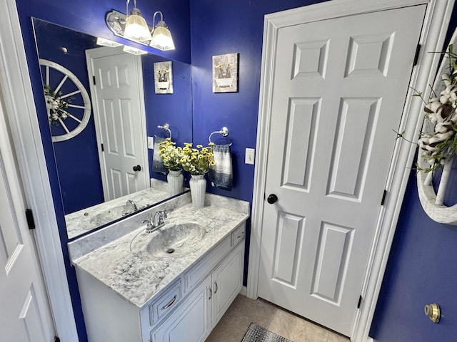 bathroom featuring tile patterned flooring and vanity