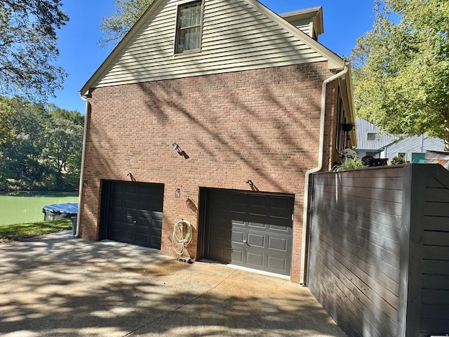 view of side of property with a garage