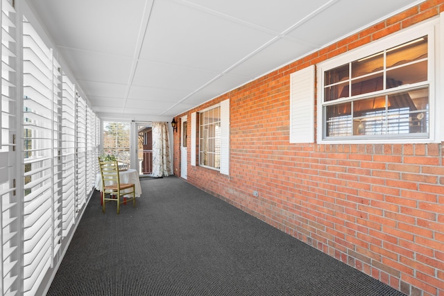 unfurnished sunroom with a paneled ceiling