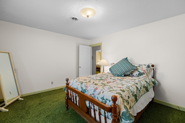 bedroom featuring a textured ceiling, carpet, visible vents, and baseboards