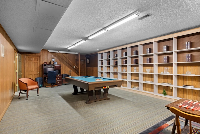 rec room with carpet floors, pool table, visible vents, wooden walls, and a textured ceiling