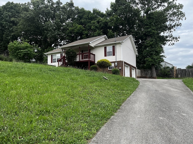 view of front facade with covered porch and a garage