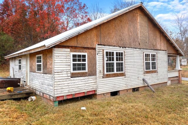 view of property exterior featuring a yard