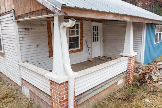 wooden terrace featuring covered porch