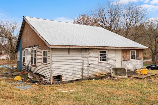 view of home's exterior featuring a yard