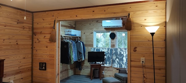 bathroom with wood walls and wood finished floors