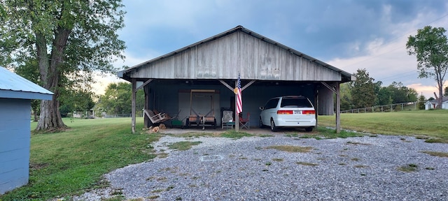 exterior space featuring a carport and a lawn