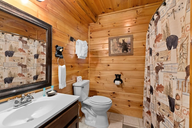 full bathroom featuring toilet, wooden walls, vanity, wooden ceiling, and tile patterned floors