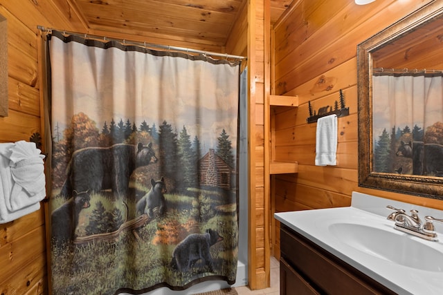 full bathroom featuring wood ceiling, wood walls, vanity, and a shower with shower curtain