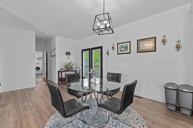 3099 Bridgewater Blvd, Morristown, TN 37814 - dining area featuring washer / dryer, light wood-style floors, baseboards, and a chandelier