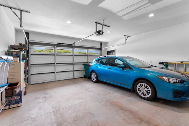 3099 Bridgewater Blvd, Morristown, TN 37814 - garage featuring a garage door opener and recessed lighting