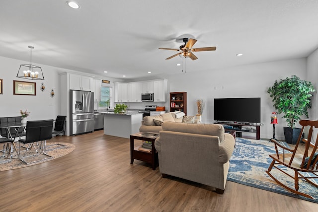 3099 Bridgewater Blvd, Morristown, TN 37814 - living area featuring ceiling fan, a chandelier, wood finished floors, and recessed lighting
