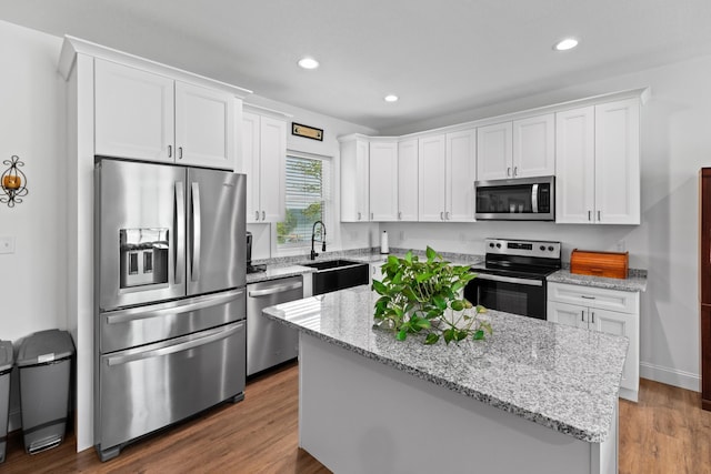 3099 Bridgewater Blvd, Morristown, TN 37814 - kitchen with appliances with stainless steel finishes, a sink, white cabinetry, recessed lighting, and light stone counters