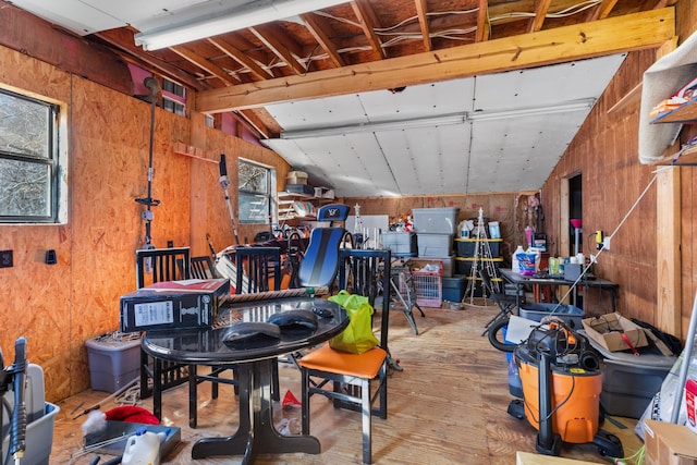 garage featuring wood walls