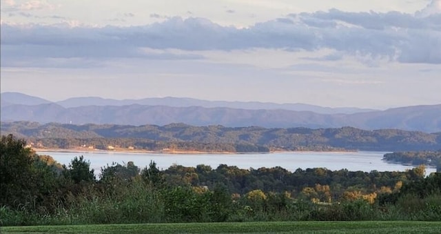 mountain view featuring a water view