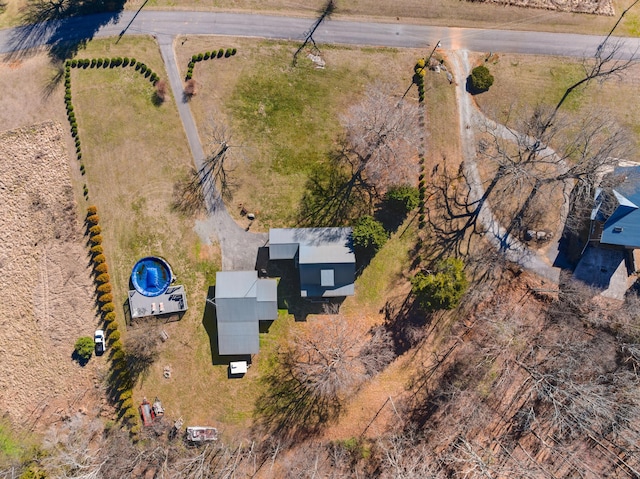 birds eye view of property with a rural view
