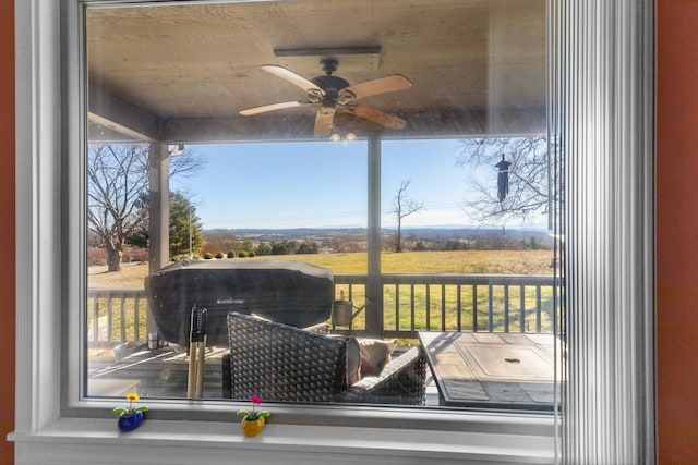 wooden terrace featuring ceiling fan