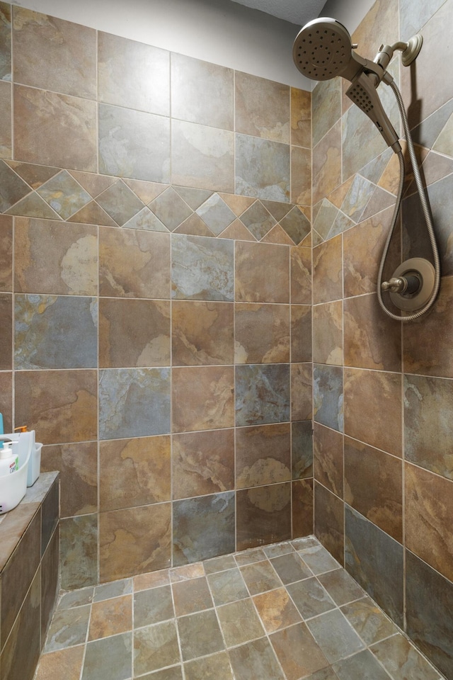 full bathroom with tiled shower