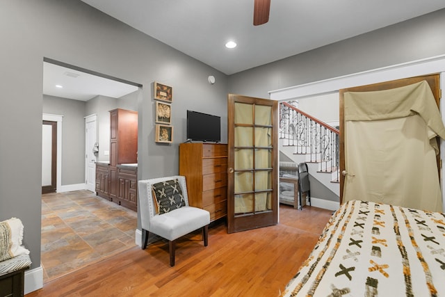 bedroom featuring baseboards, recessed lighting, a ceiling fan, and connected bathroom