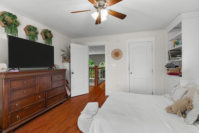 bedroom with wood finished floors and a ceiling fan