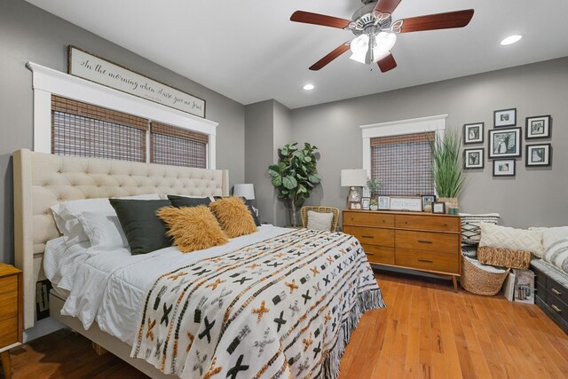 bedroom featuring wood finished floors, recessed lighting, and a ceiling fan