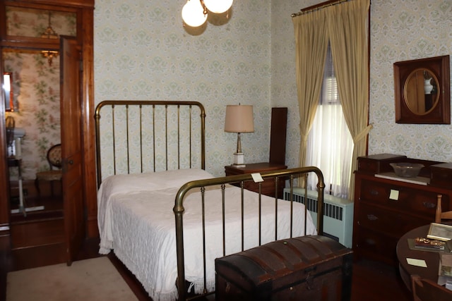 bedroom featuring radiator heating unit