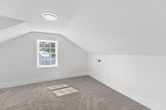 bonus room with carpet and lofted ceiling