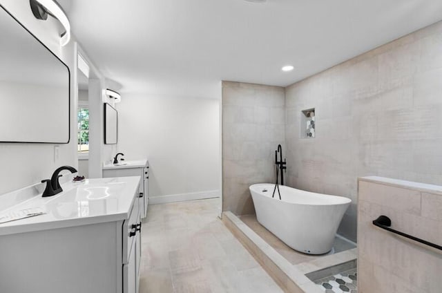 bathroom with vanity and a bathtub