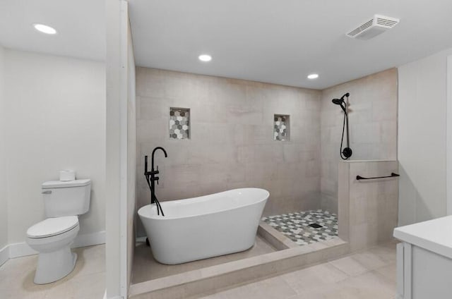 full bathroom with tile patterned floors, vanity, toilet, and shower with separate bathtub