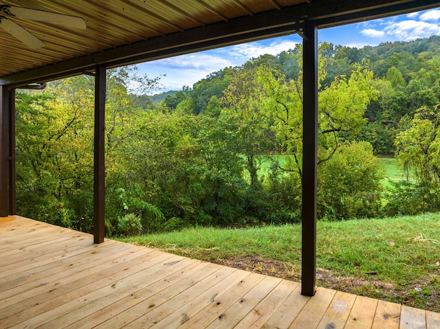 wooden deck featuring ceiling fan