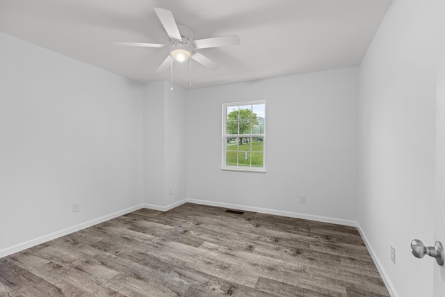 spare room featuring ceiling fan and light hardwood / wood-style flooring