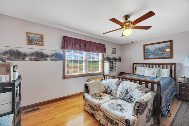 bedroom featuring hardwood / wood-style flooring and ceiling fan