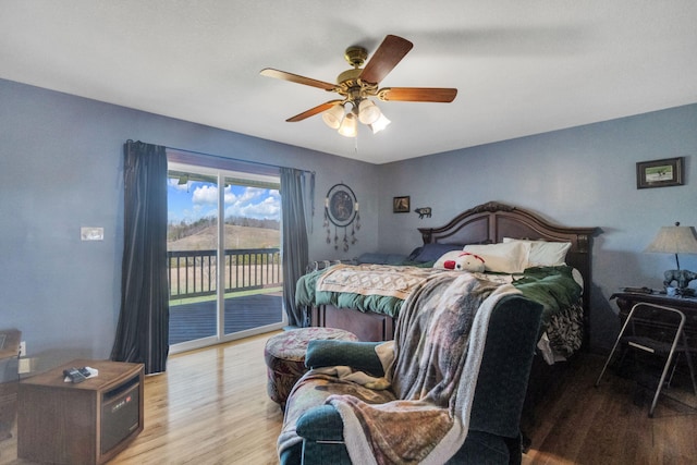 bedroom featuring ceiling fan, light hardwood / wood-style floors, and access to outside