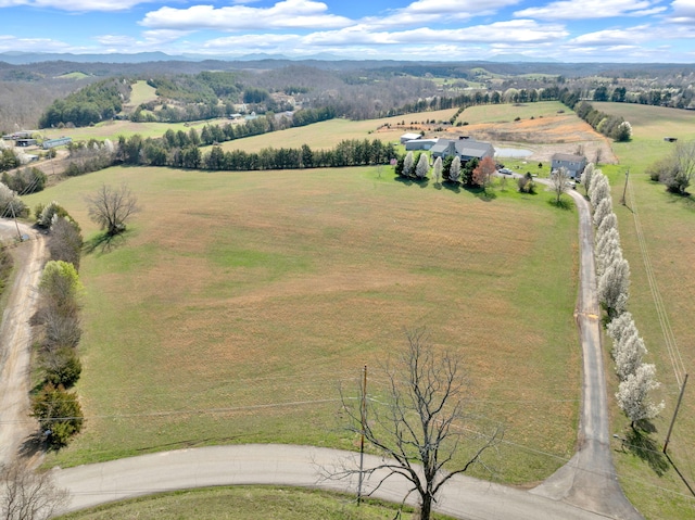 drone / aerial view featuring a mountain view and a rural view