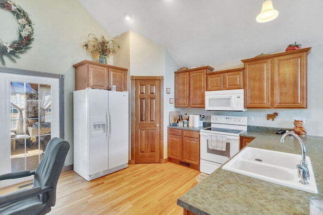 kitchen with sink, high vaulted ceiling, light hardwood / wood-style floors, and white appliances