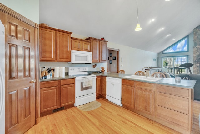 kitchen with sink, light hardwood / wood-style flooring, kitchen peninsula, pendant lighting, and white appliances