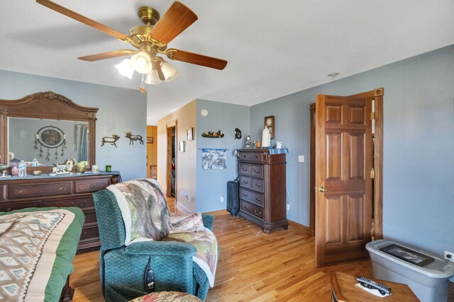 bedroom featuring ceiling fan and light wood-type flooring