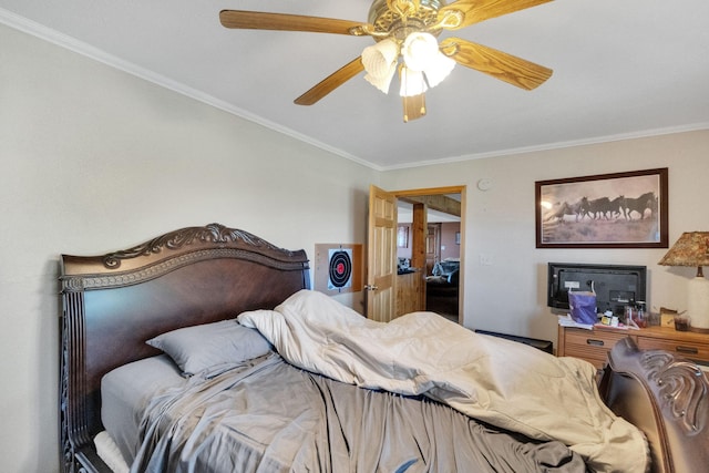 bedroom with ceiling fan and ornamental molding