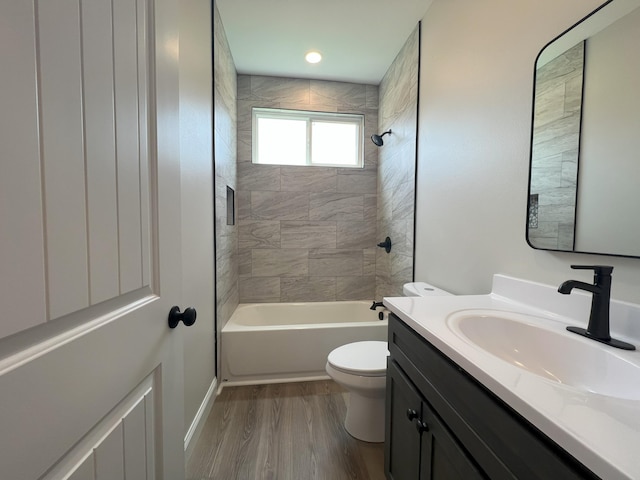 536 Sequoyah Dr, Morristown, TN 37813 - bathroom featuring toilet, vanity, wood finished floors, and tub / shower combination